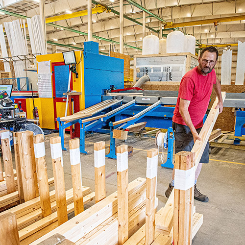 CNC Saw by Hundegger at KBS Builders Factory in South Paris Maine